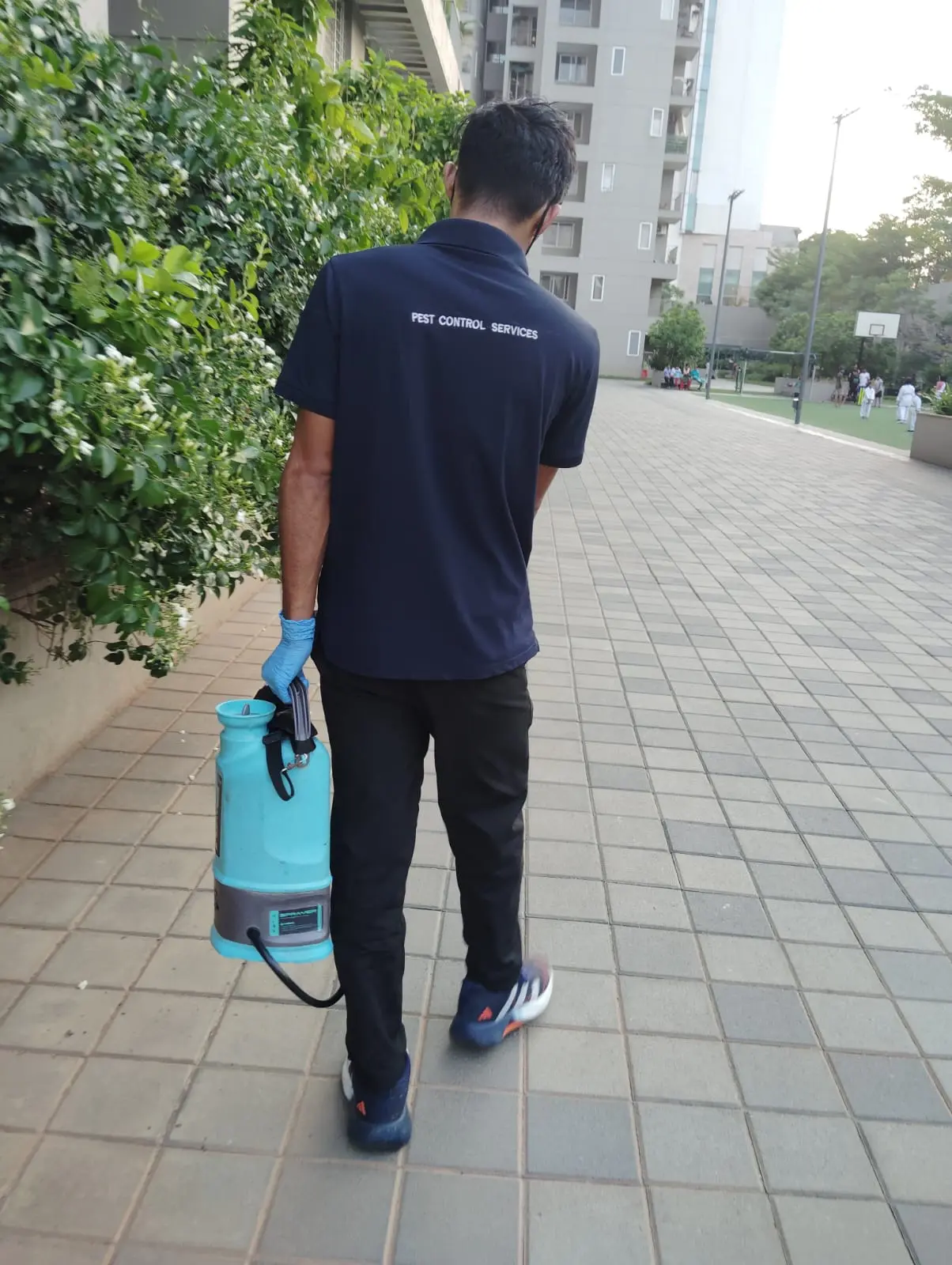 Technician performing a pest control treatment